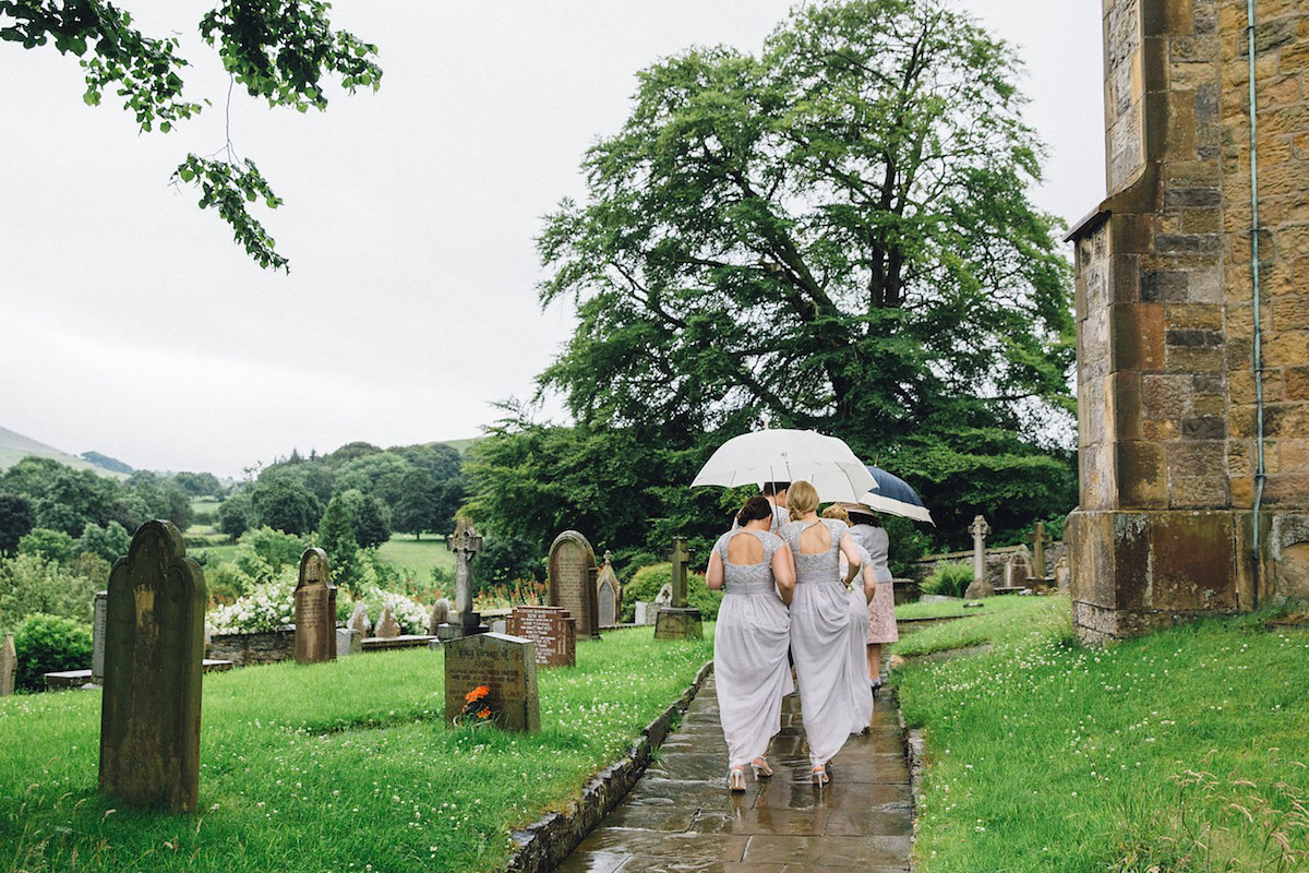 Caroline wore a Martina Liana gown for her elegant rainy day barn wedding. Images captured by Red On Blonde Photography.