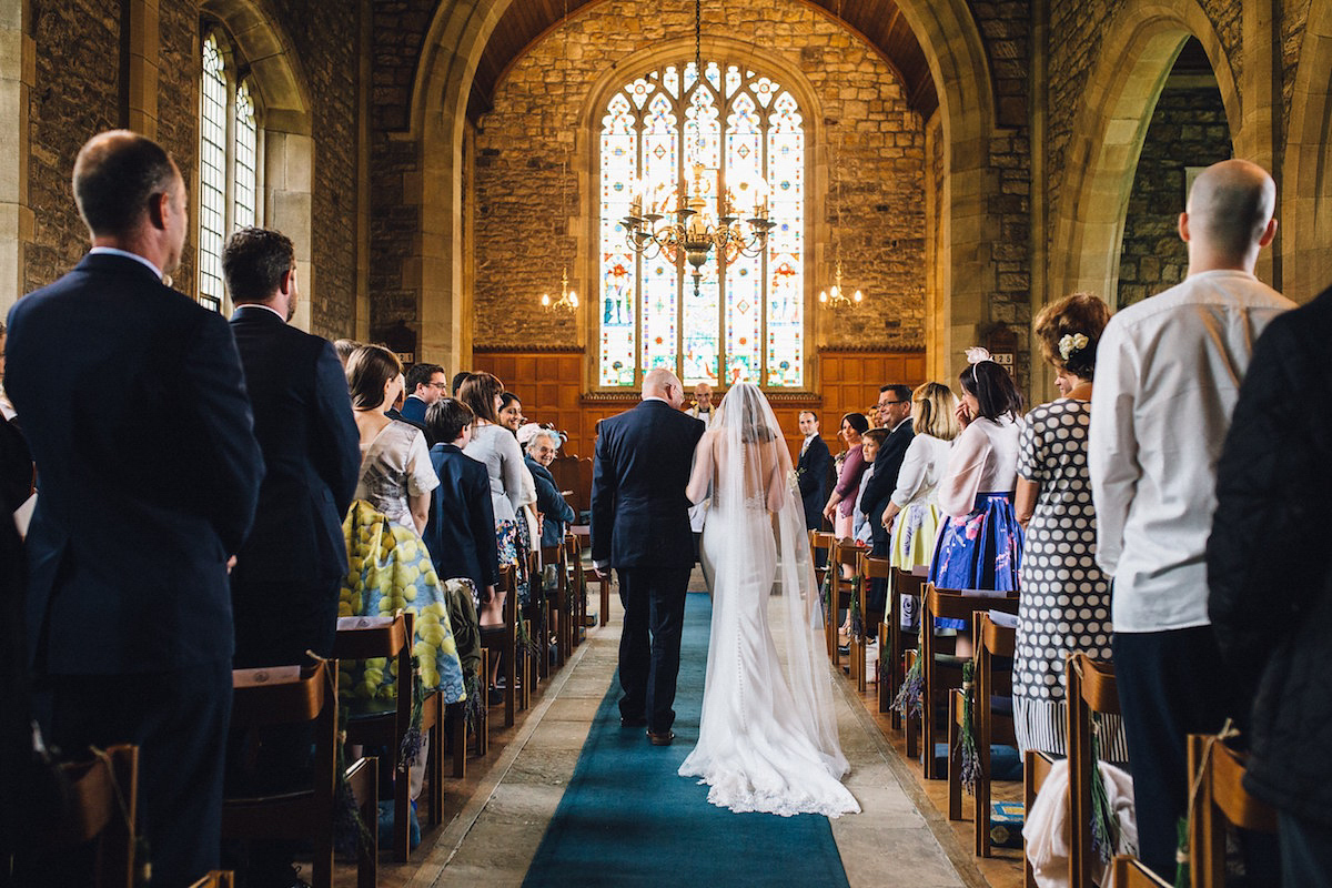 Caroline wore a Martina Liana gown for her elegant rainy day barn wedding. Images captured by Red On Blonde Photography.