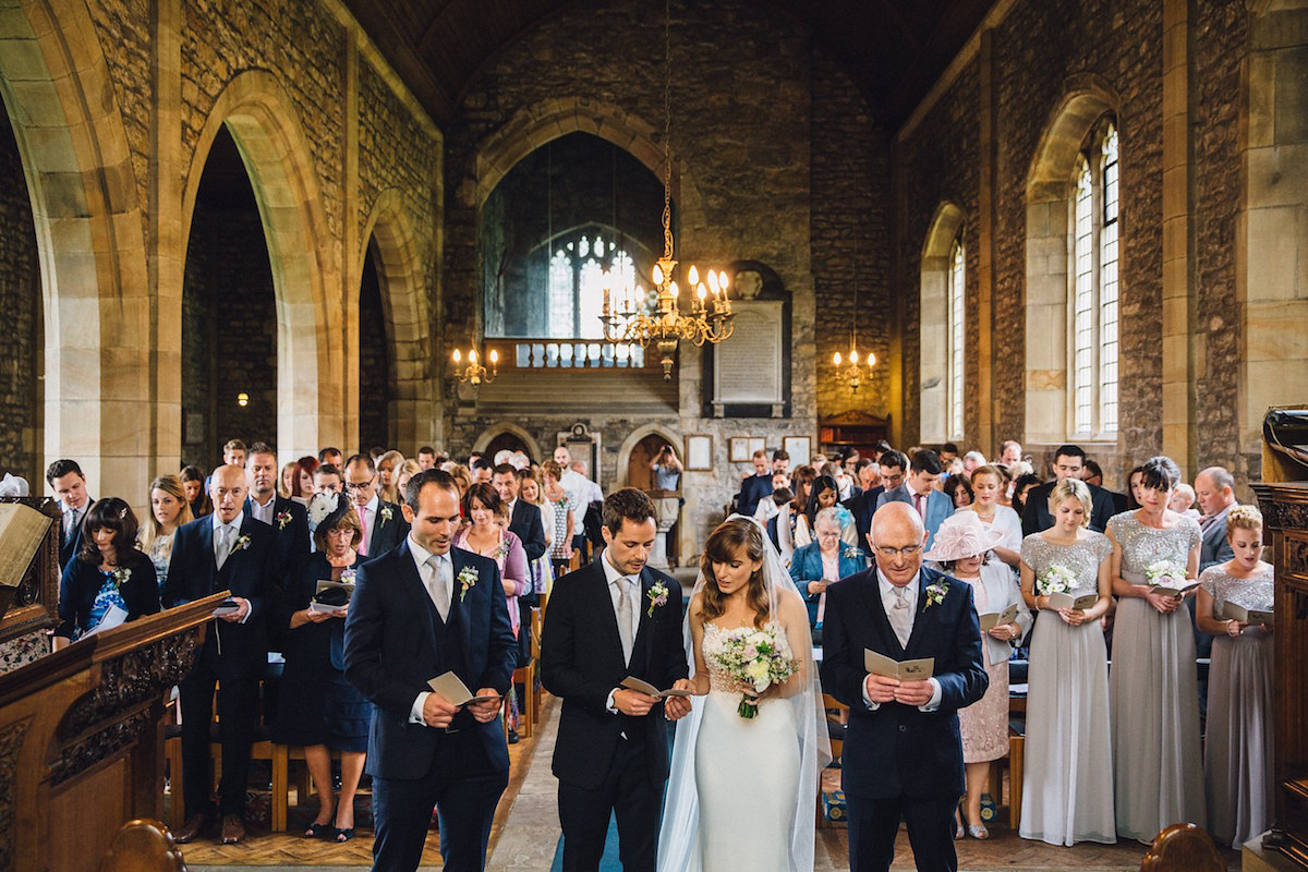 Caroline wore a Martina Liana gown for her elegant rainy day barn wedding. Images captured by Red On Blonde Photography.