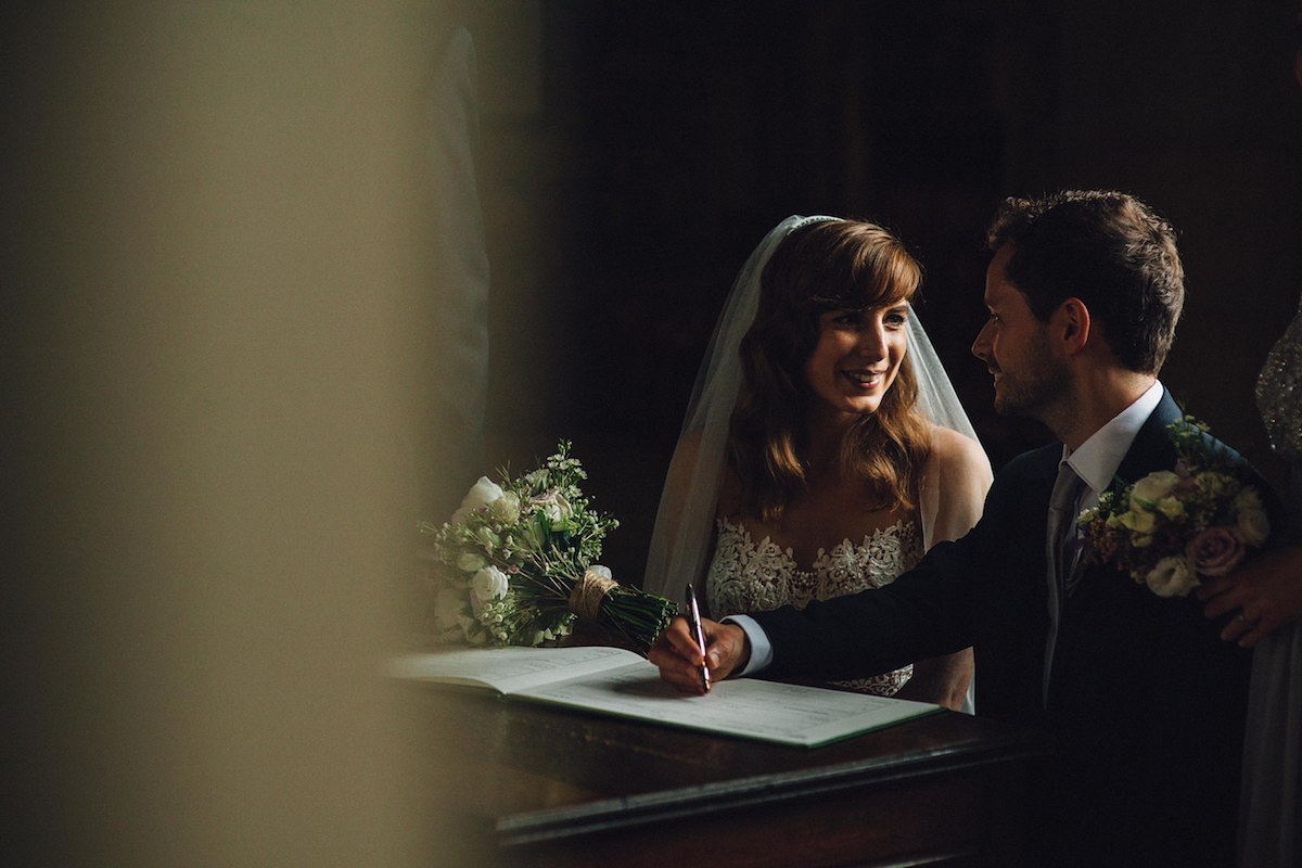 Caroline wore a Martina Liana gown for her elegant rainy day barn wedding. Images captured by Red On Blonde Photography.