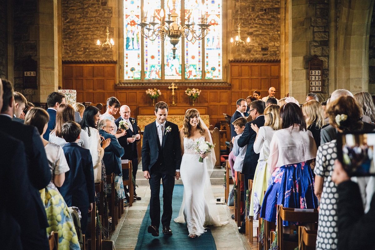 Caroline wore a Martina Liana gown for her elegant rainy day barn wedding. Images captured by Red On Blonde Photography.