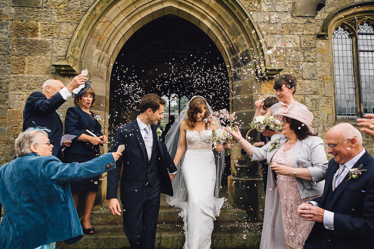 Caroline wore a Martina Liana gown for her elegant rainy day barn wedding. Images captured by Red On Blonde Photography.