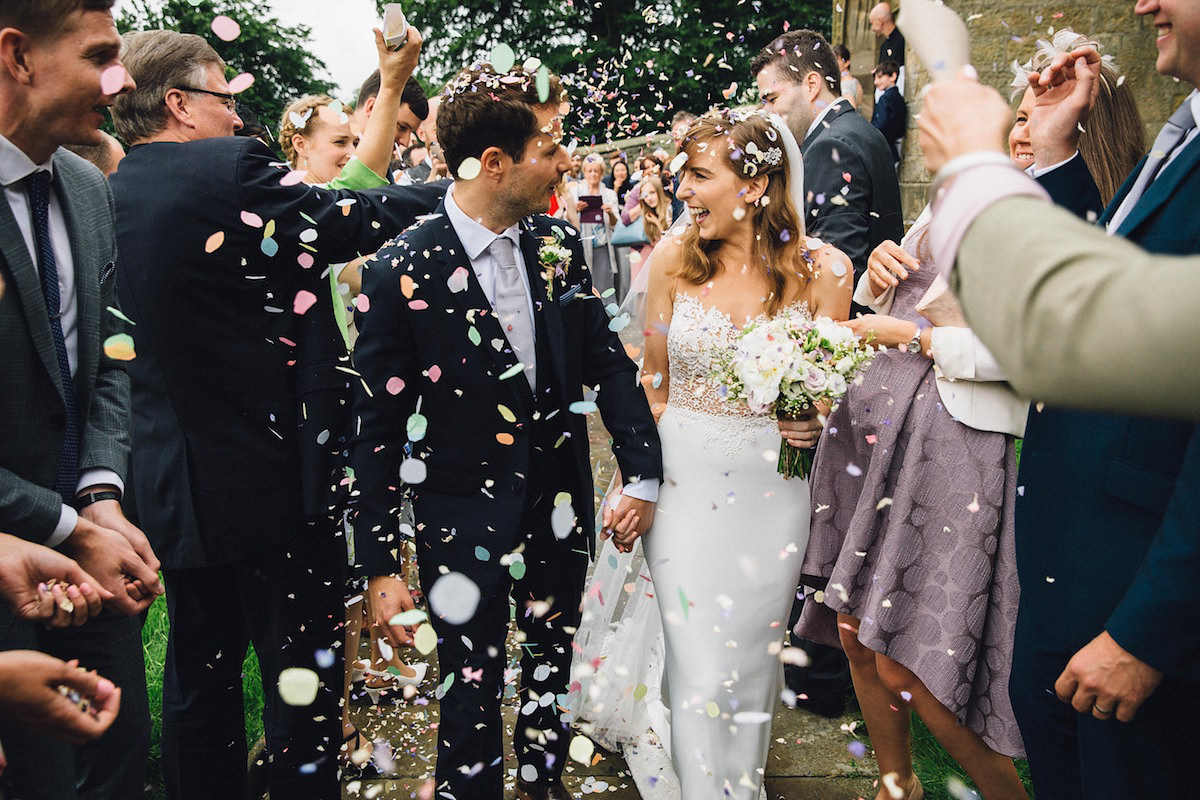 Caroline wore a Martina Liana gown for her elegant rainy day barn wedding. Images captured by Red On Blonde Photography.