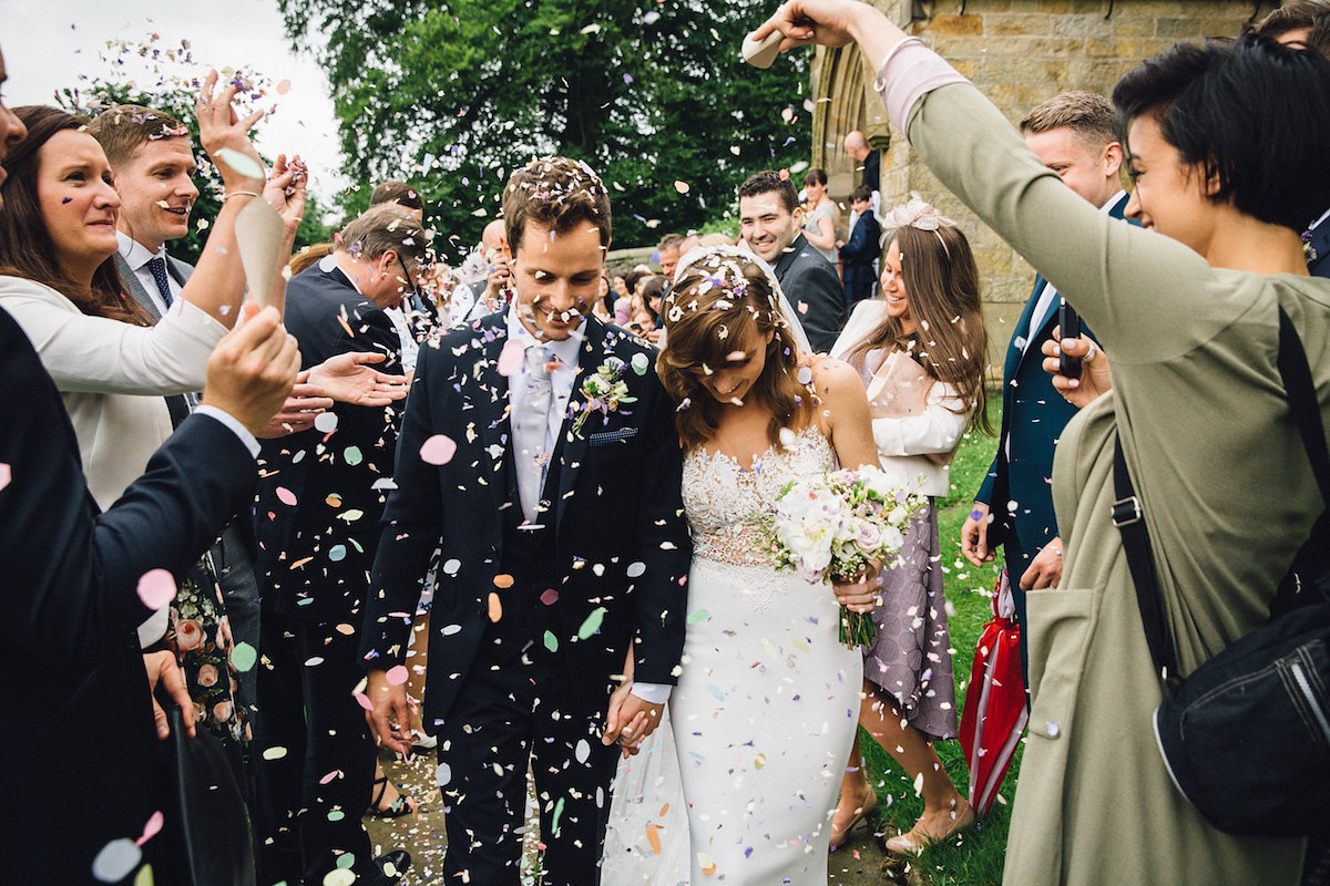 Caroline wore a Martina Liana gown for her elegant rainy day barn wedding. Images captured by Red On Blonde Photography.