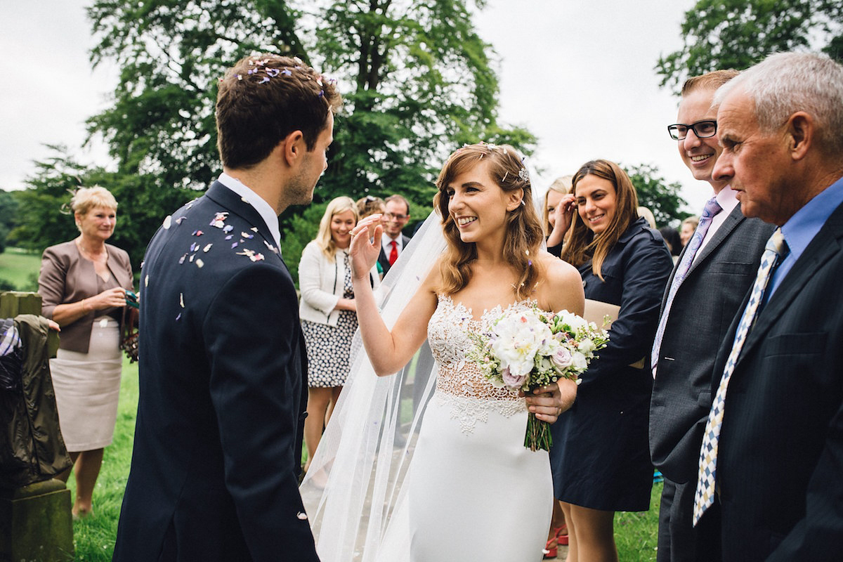 Caroline wore a Martina Liana gown for her elegant rainy day barn wedding. Images captured by Red On Blonde Photography.