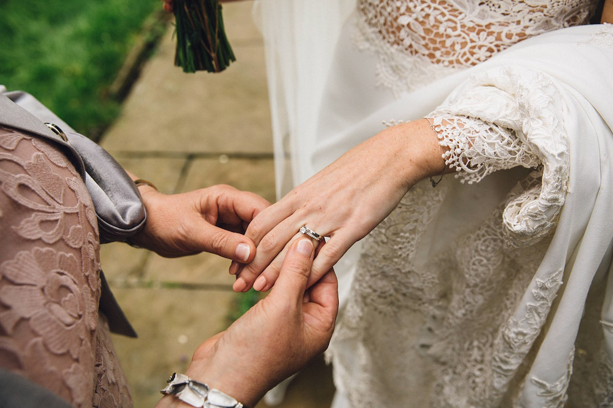 Caroline wore a Martina Liana gown for her elegant rainy day barn wedding. Images captured by Red On Blonde Photography.