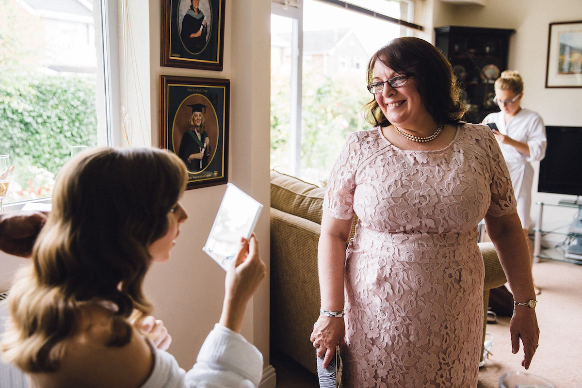 Caroline wore a Martina Liana gown for her elegant rainy day barn wedding. Images captured by Red On Blonde Photography.