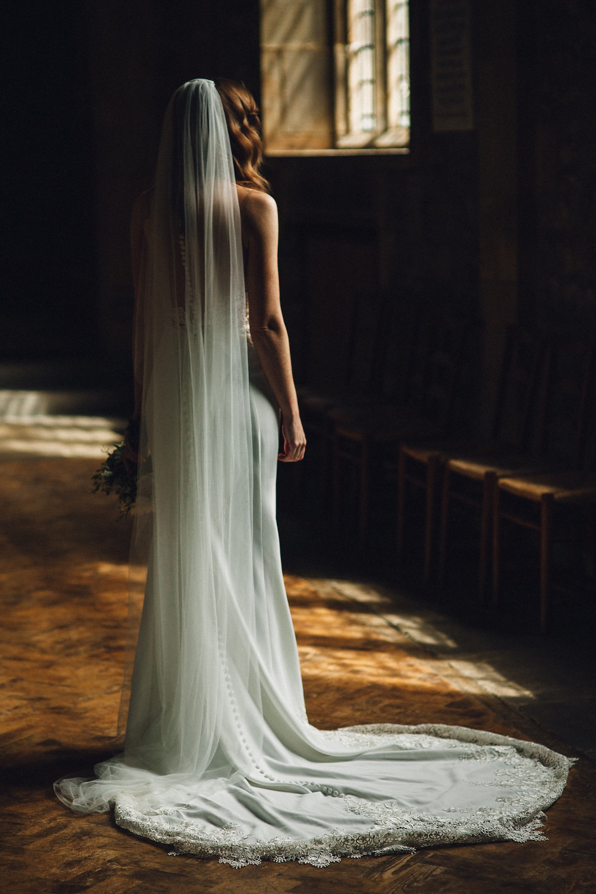 Caroline wore a Martina Liana gown for her elegant rainy day barn wedding. Images captured by Red On Blonde Photography.