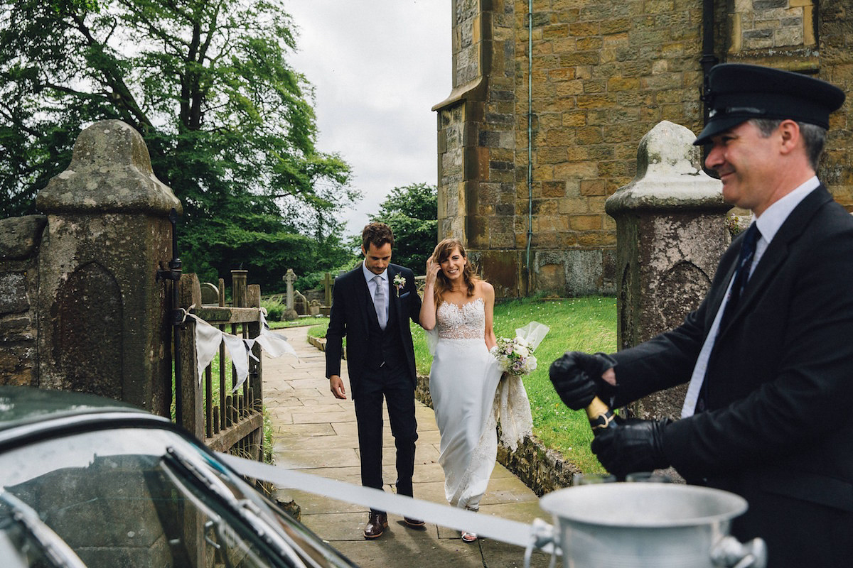 Caroline wore a Martina Liana gown for her elegant rainy day barn wedding. Images captured by Red On Blonde Photography.