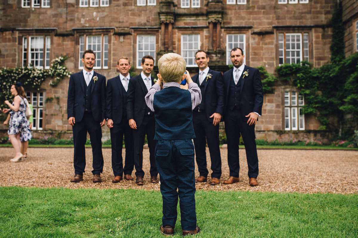 Caroline wore a Martina Liana gown for her elegant rainy day barn wedding. Images captured by Red On Blonde Photography.