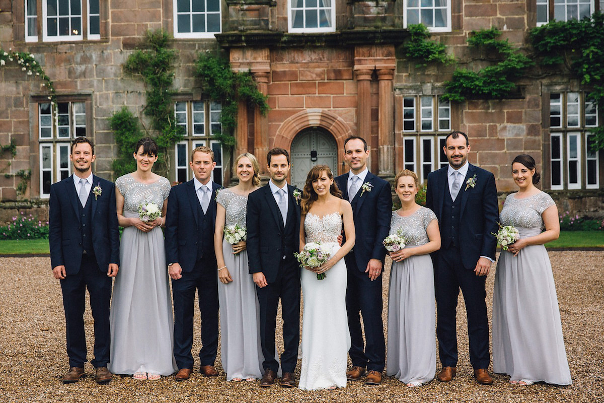 Caroline wore a Martina Liana gown for her elegant rainy day barn wedding. Images captured by Red On Blonde Photography.