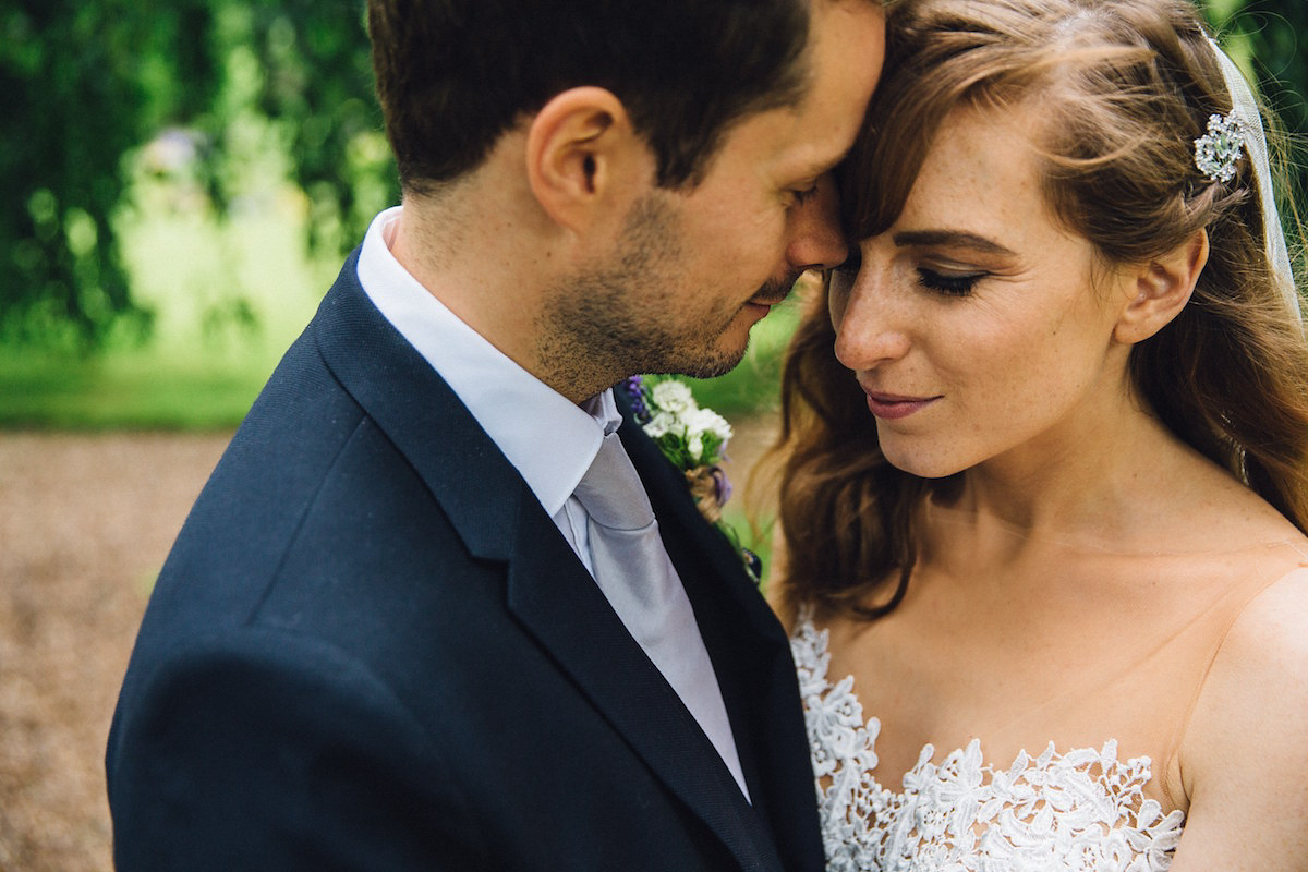 Caroline wore a Martina Liana gown for her elegant rainy day barn wedding. Images captured by Red On Blonde Photography.