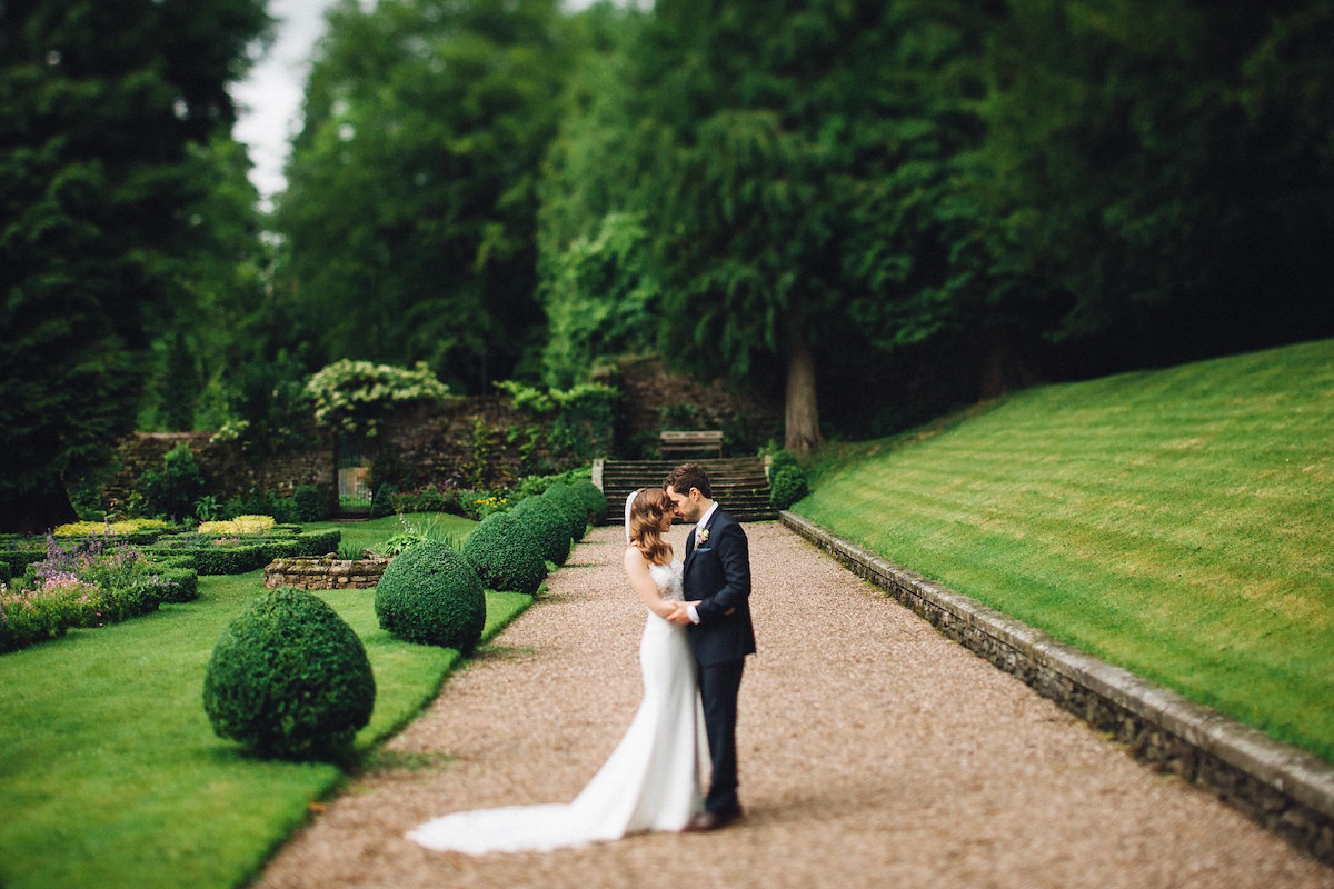 Caroline wore a Martina Liana gown for her elegant rainy day barn wedding. Images captured by Red On Blonde Photography.