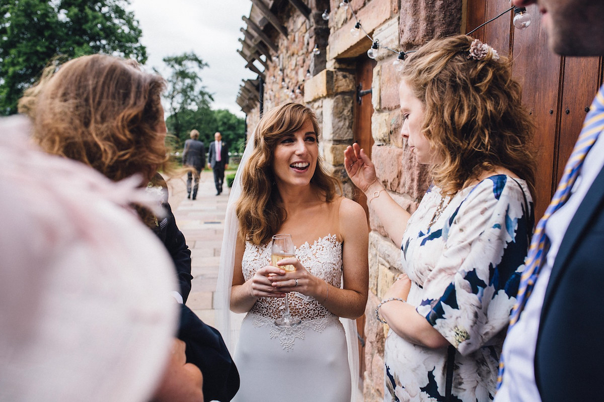 Caroline wore a Martina Liana gown for her elegant rainy day barn wedding. Images captured by Red On Blonde Photography.