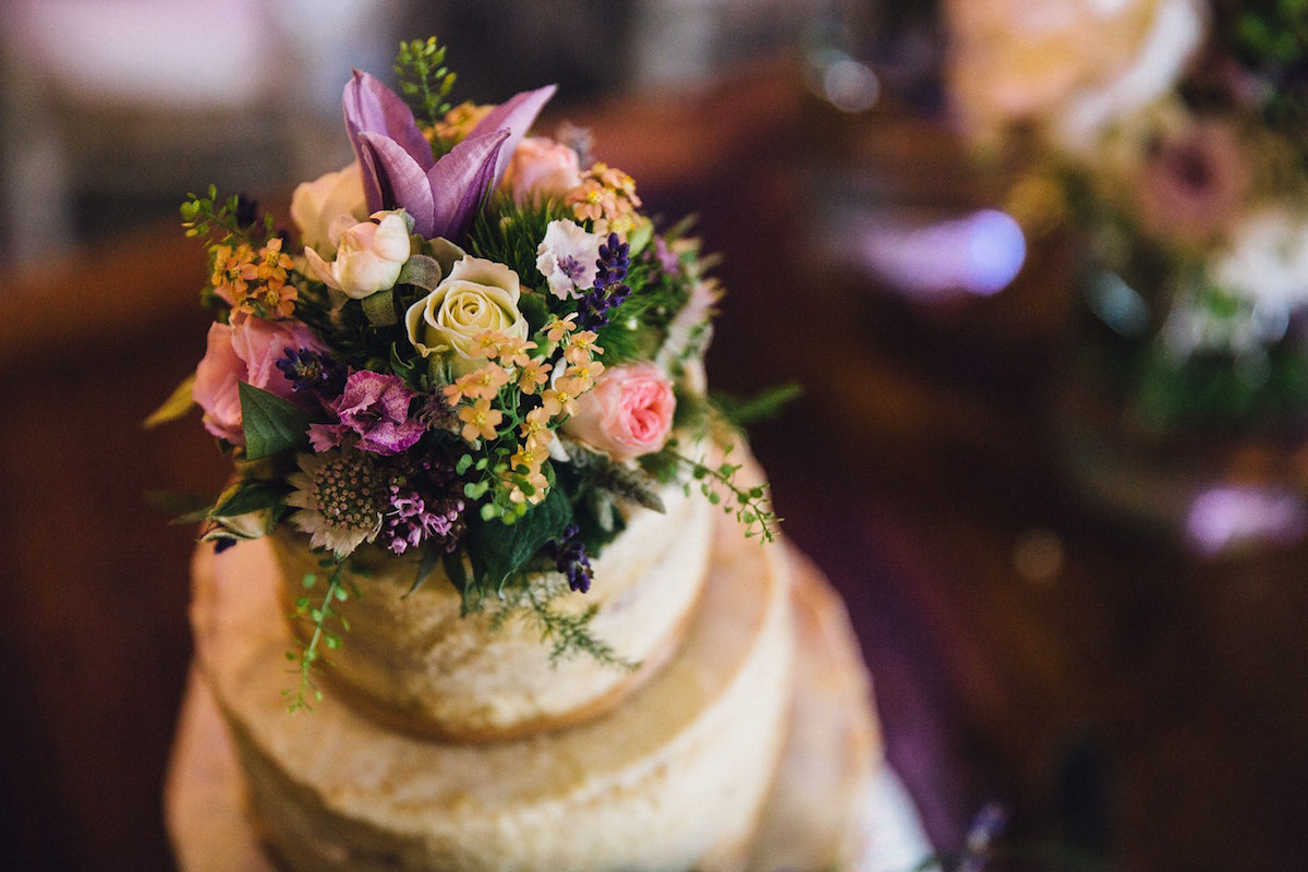 Caroline wore a Martina Liana gown for her elegant rainy day barn wedding. Images captured by Red On Blonde Photography.