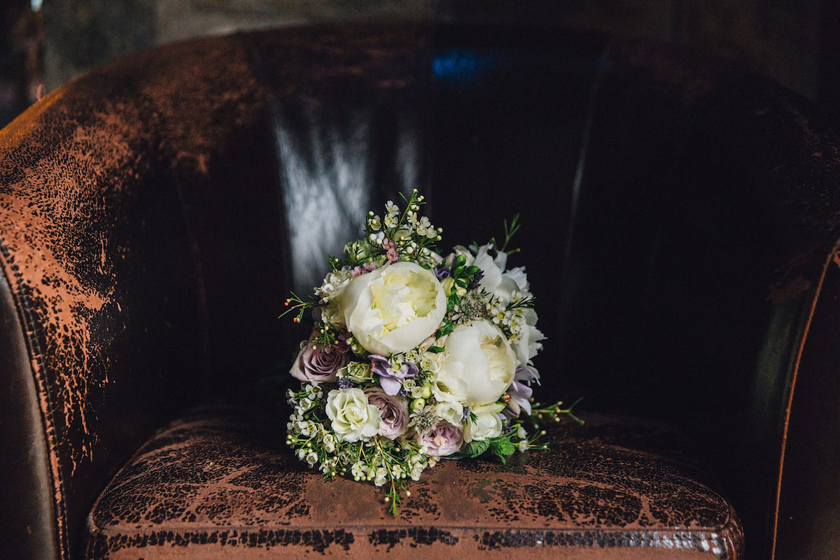 Caroline wore a Martina Liana gown for her elegant rainy day barn wedding. Images captured by Red On Blonde Photography.