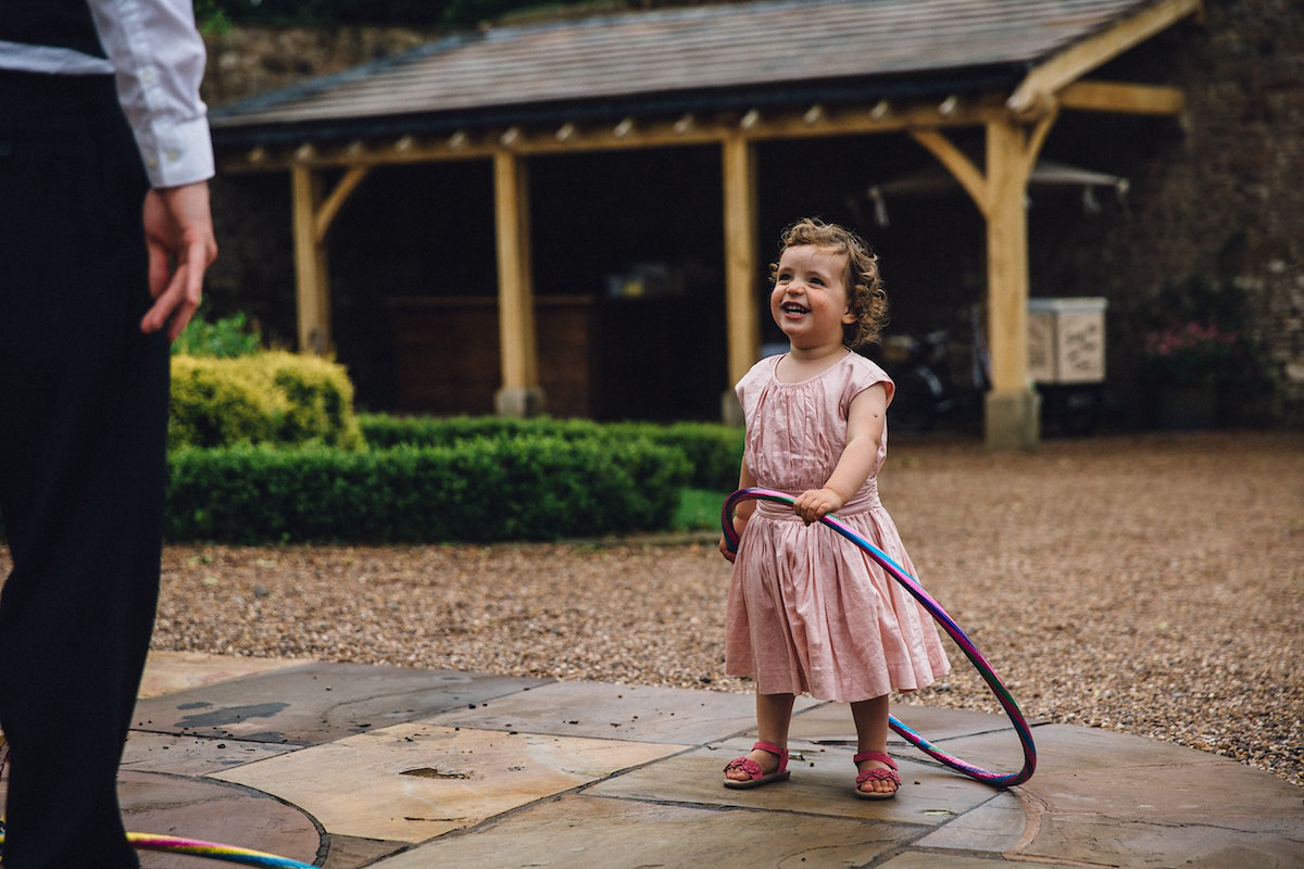 Caroline wore a Martina Liana gown for her elegant rainy day barn wedding. Images captured by Red On Blonde Photography.