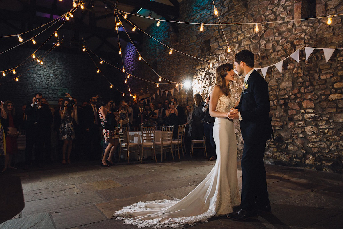 Caroline wore a Martina Liana gown for her elegant rainy day barn wedding. Images captured by Red On Blonde Photography.