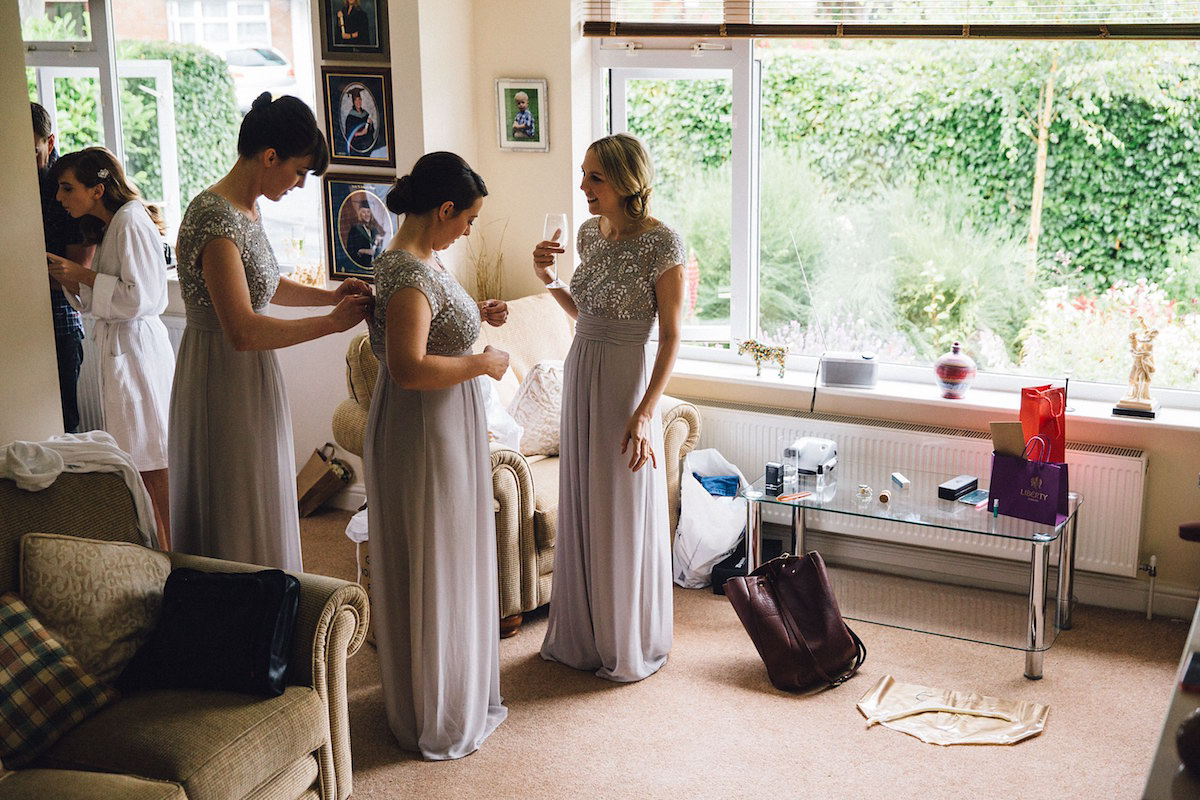 Caroline wore a Martina Liana gown for her elegant rainy day barn wedding. Images captured by Red On Blonde Photography.