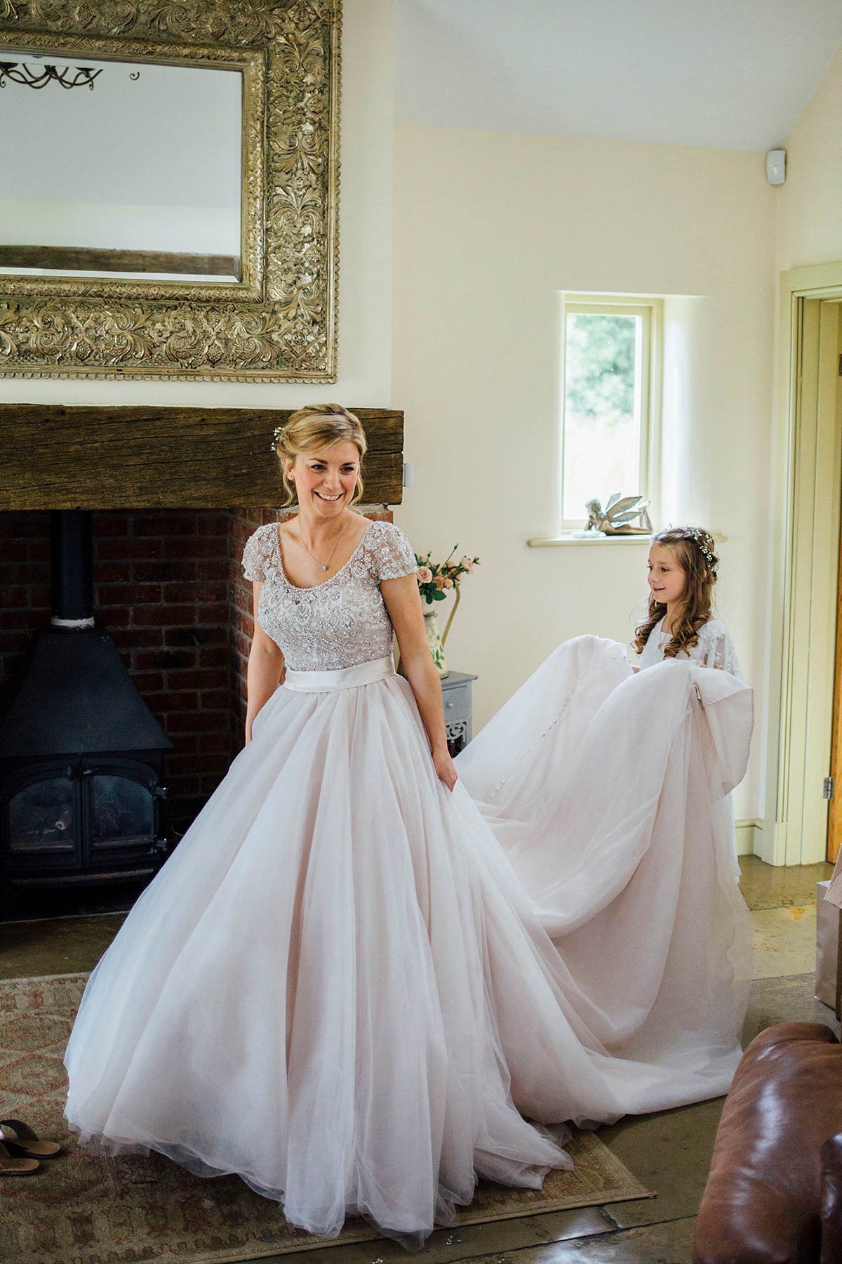 Laurie wore a blush pink tulle gown by Allure Bridals for her English country, vintage inspired wedding. Photography by Rachael Fraser.