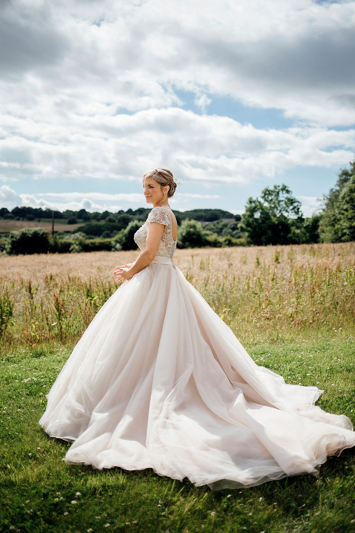 Laurie wore a blush pink tulle gown by Allure Bridals for her English country, vintage inspired wedding. Photography by Rachael Fraser.