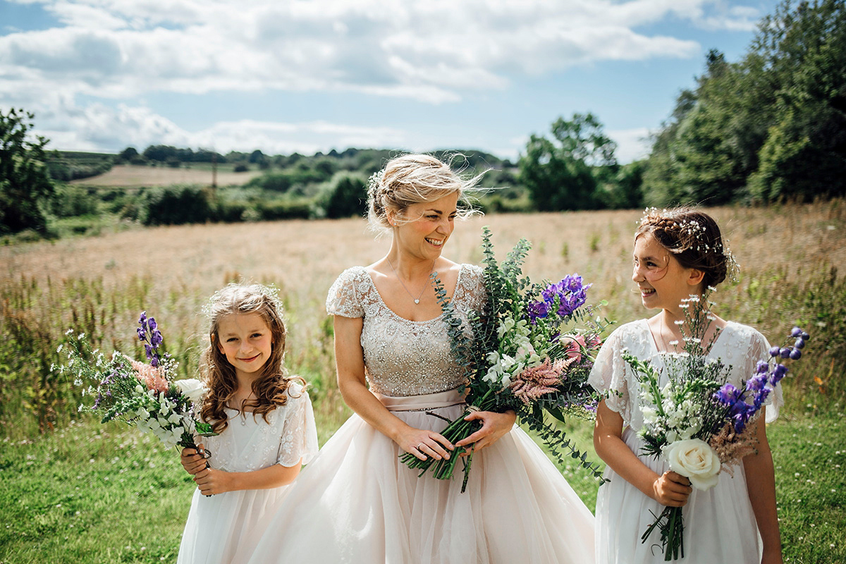 Laurie wore a blush pink tulle gown by Allure Bridals for her English country, vintage inspired wedding. Photography by Rachael Fraser.