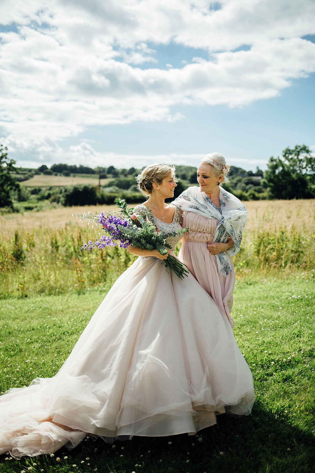 Laurie wore a blush pink tulle gown by Allure Bridals for her English country, vintage inspired wedding. Photography by Rachael Fraser.