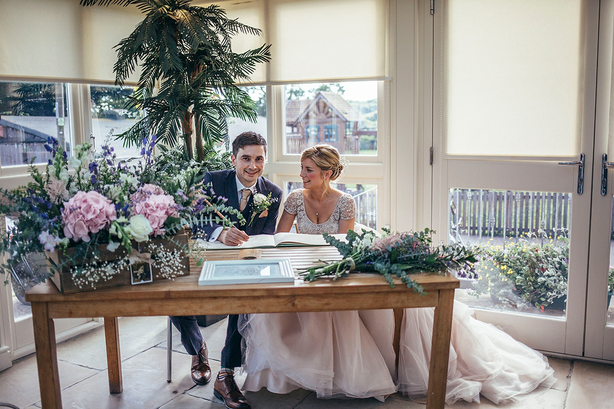 Laurie wore a blush pink tulle gown by Allure Bridals for her English country, vintage inspired wedding. Photography by Rachael Fraser.