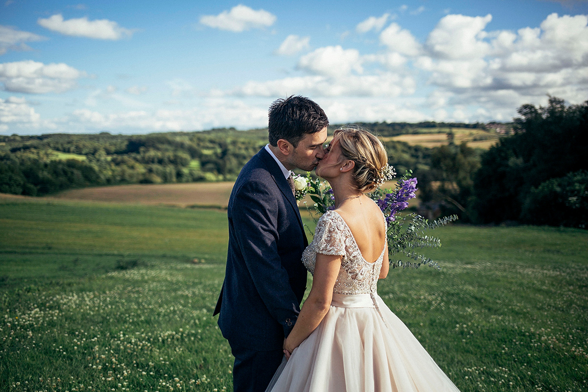 Laurie wore a blush pink tulle gown by Allure Bridals for her English country, vintage inspired wedding. Photography by Rachael Fraser.