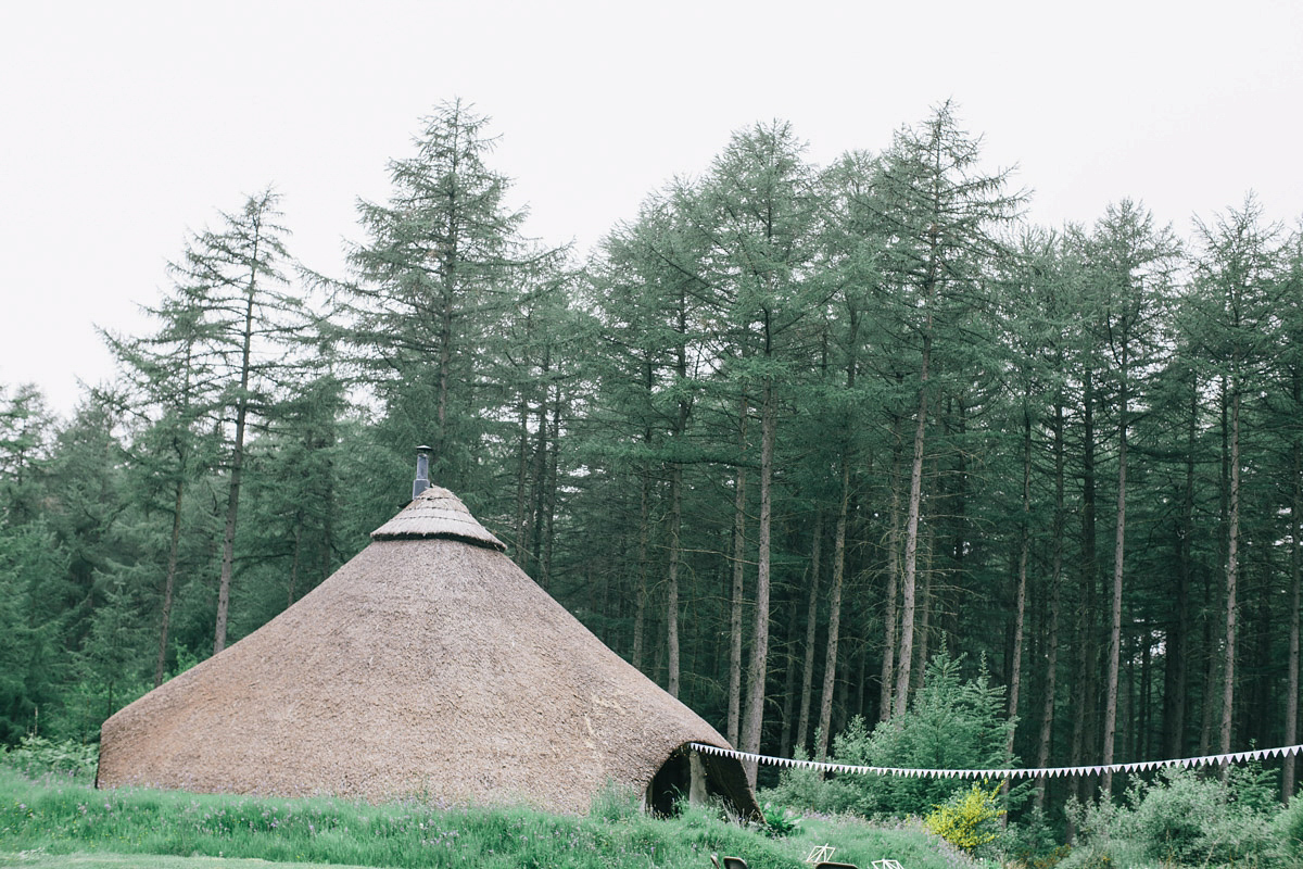 Sarah wore a 1950's inspired tea length wedding dress for her woodland wedding in Scotland. Images captured by Mirrorbox Photography.