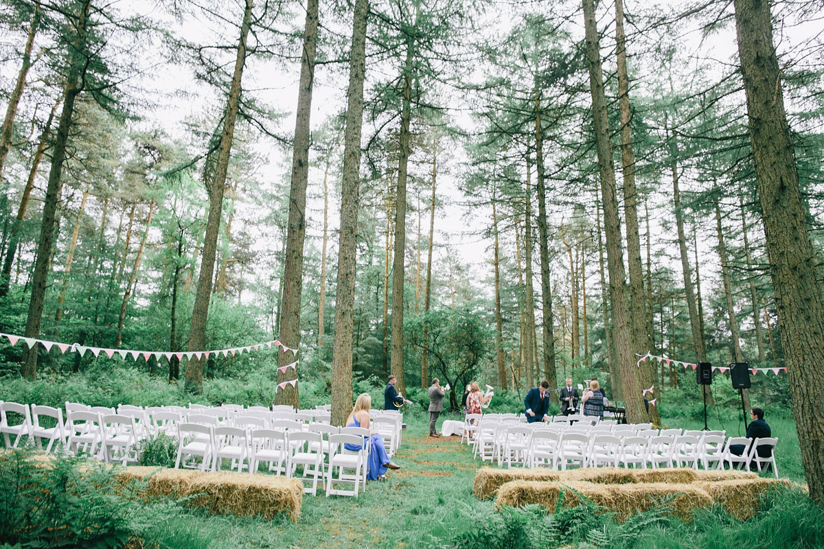 Sarah wore a 1950's inspired tea length wedding dress for her woodland wedding in Scotland. Images captured by Mirrorbox Photography.