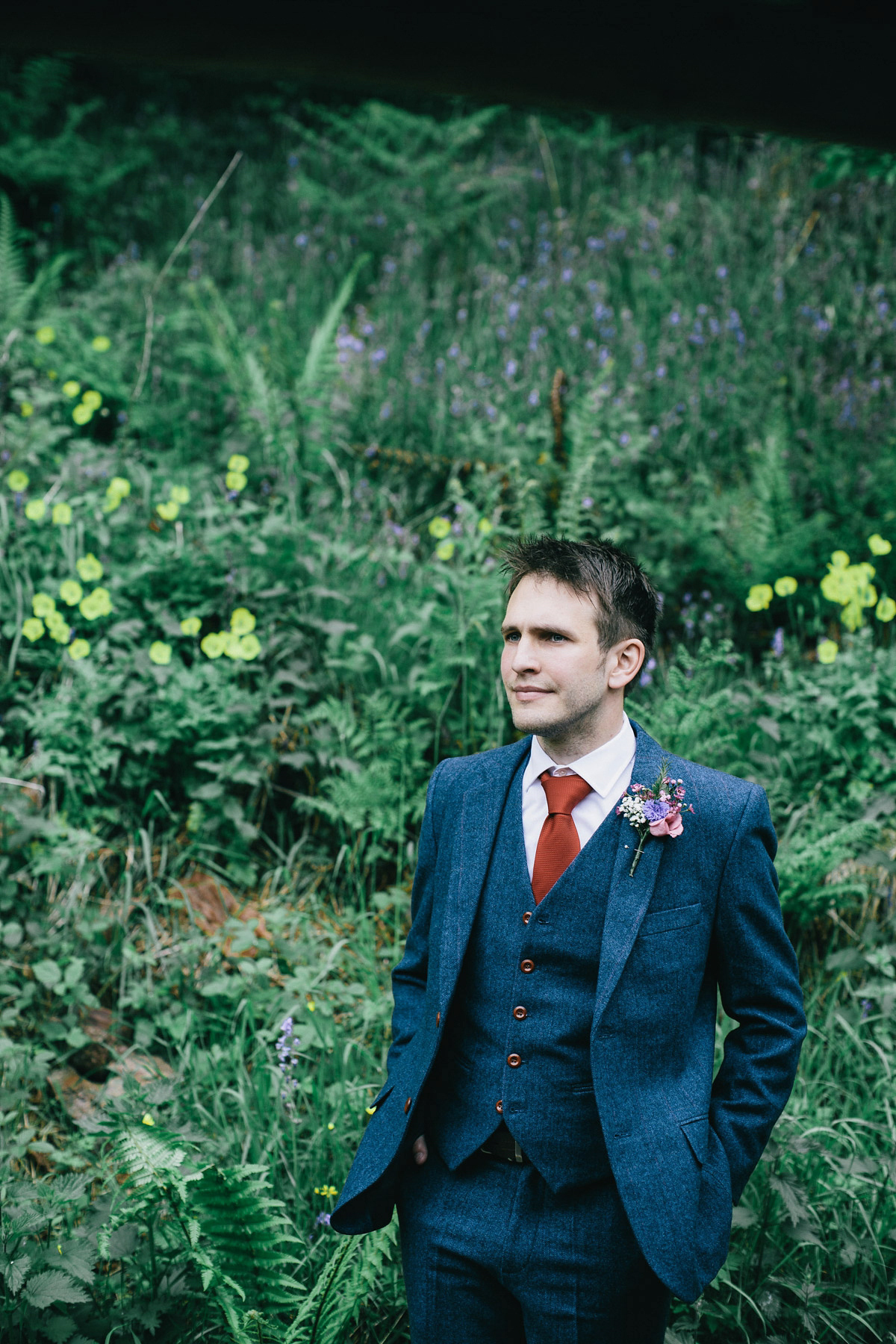 Sarah wore a 1950's inspired tea length wedding dress for her woodland wedding in Scotland. Images captured by Mirrorbox Photography.