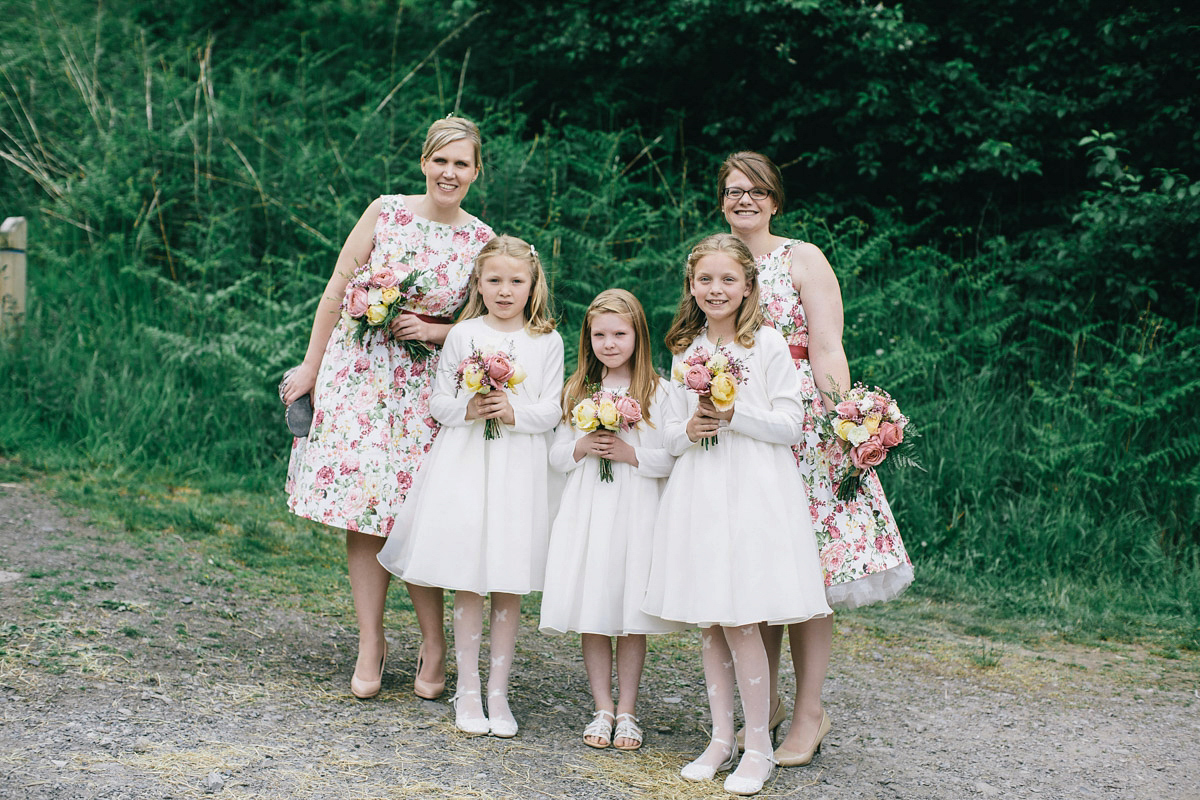 Sarah wore a 1950's inspired tea length wedding dress for her woodland wedding in Scotland. Images captured by Mirrorbox Photography.