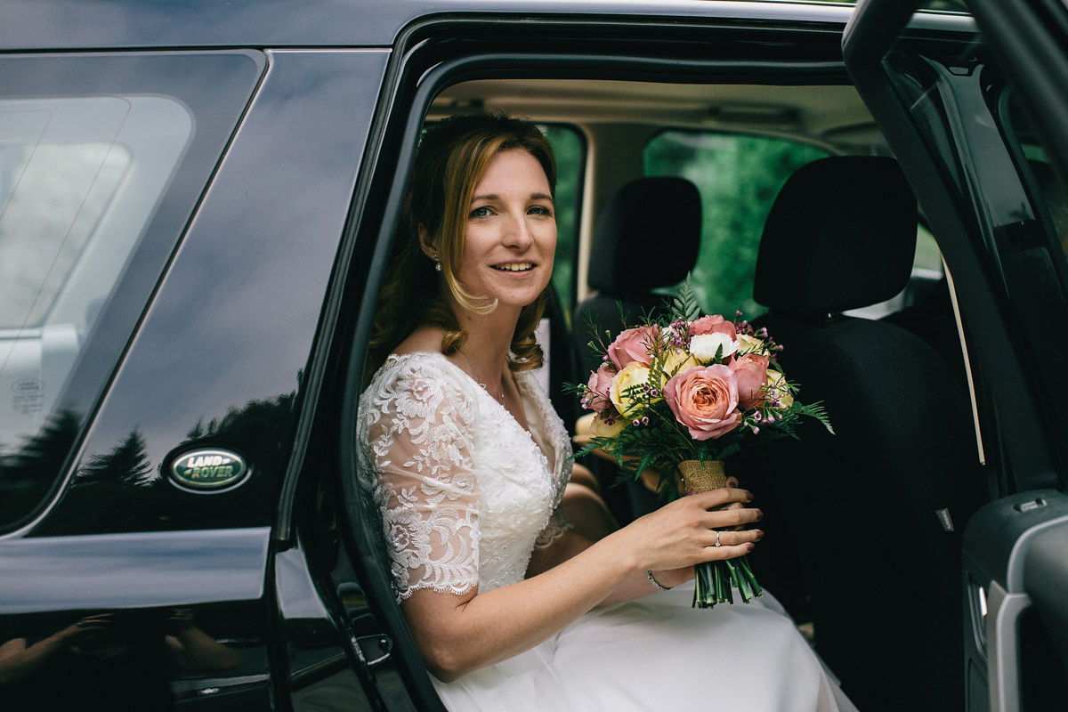 Sarah wore a 1950's inspired tea length wedding dress for her woodland wedding in Scotland. Images captured by Mirrorbox Photography.