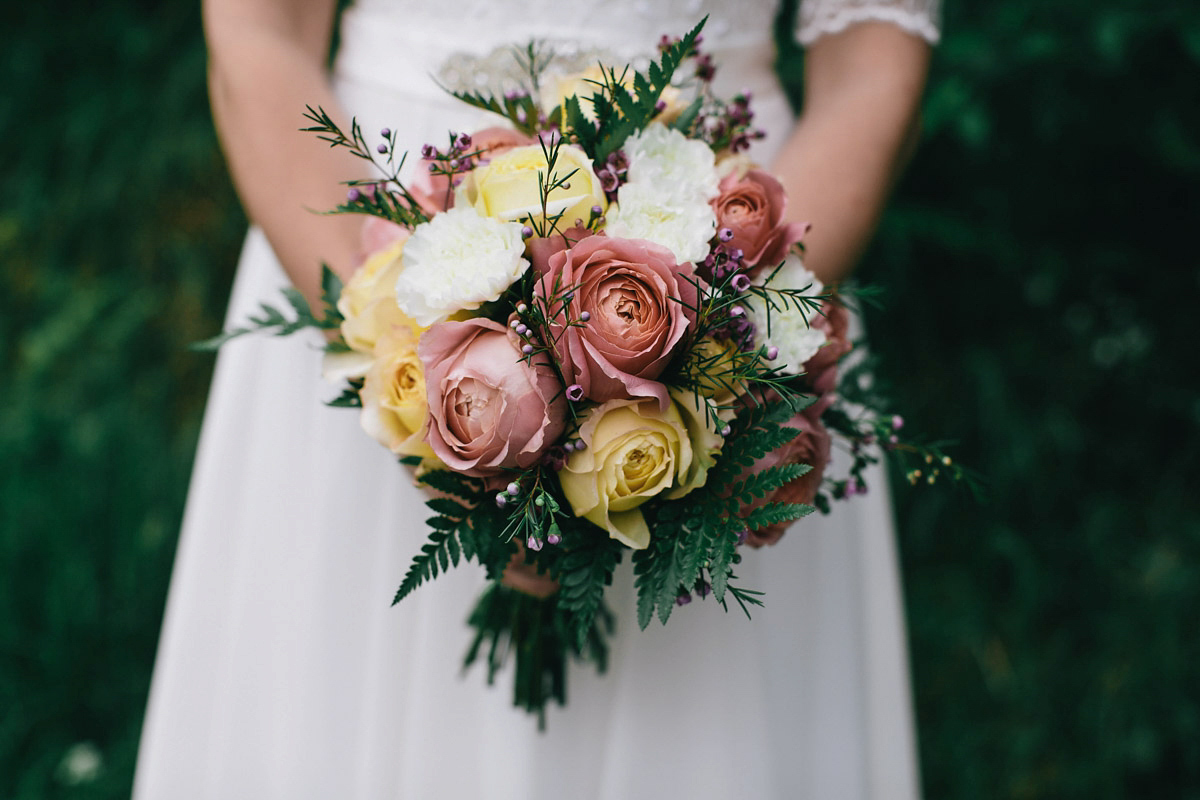 Sarah wore a 1950's inspired tea length wedding dress for her woodland wedding in Scotland. Images captured by Mirrorbox Photography.