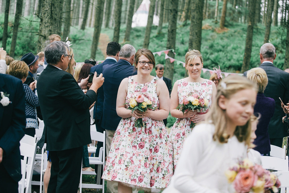 Sarah wore a 1950's inspired tea length wedding dress for her woodland wedding in Scotland. Images captured by Mirrorbox Photography.