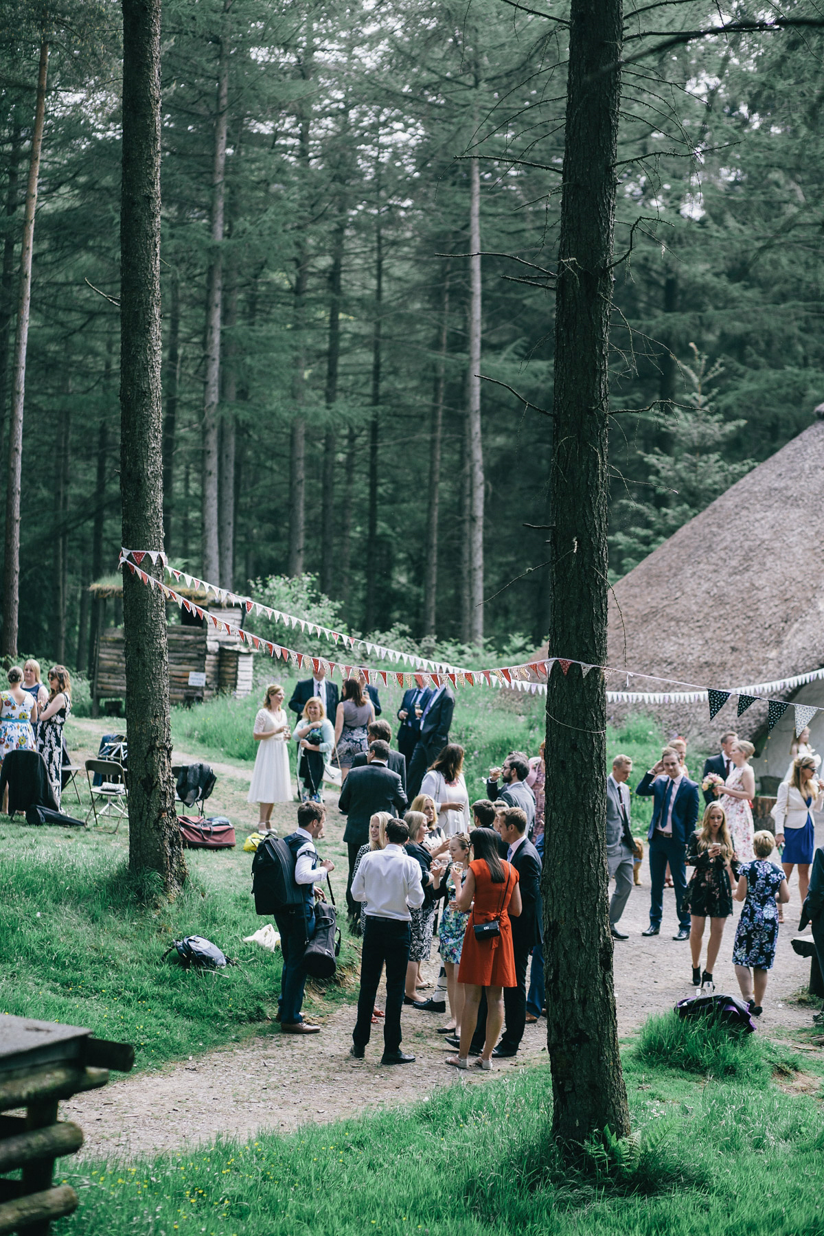 Sarah wore a 1950's inspired tea length wedding dress for her woodland wedding in Scotland. Images captured by Mirrorbox Photography.