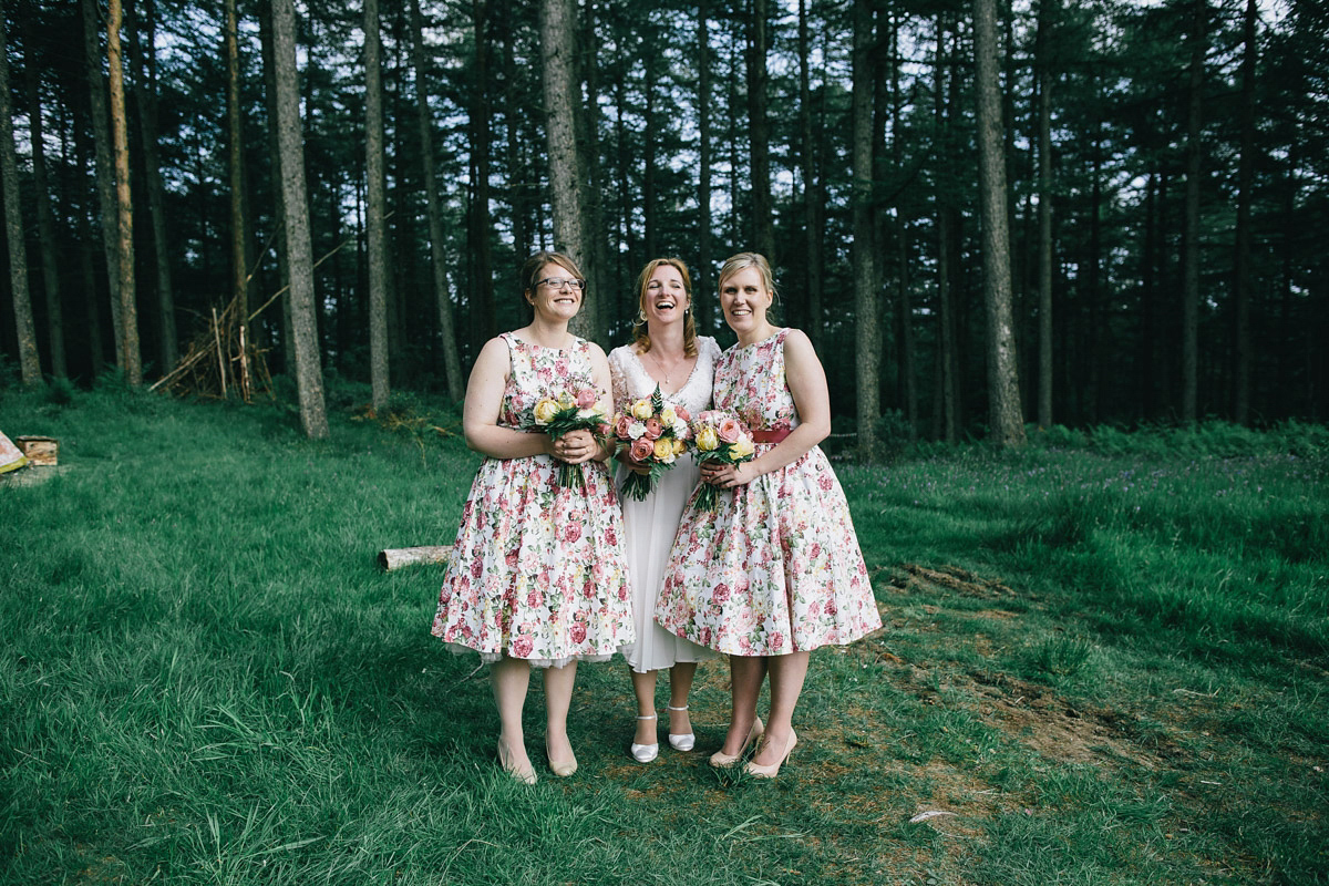 Sarah wore a 1950's inspired tea length wedding dress for her woodland wedding in Scotland. Images captured by Mirrorbox Photography.