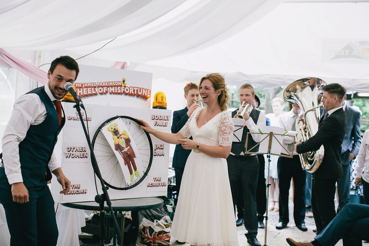 Sarah wore a 1950's inspired tea length wedding dress for her woodland wedding in Scotland. Images captured by Mirrorbox Photography.