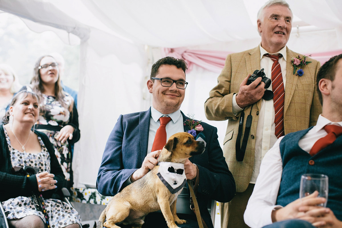 Sarah wore a 1950's inspired tea length wedding dress for her woodland wedding in Scotland. Images captured by Mirrorbox Photography.