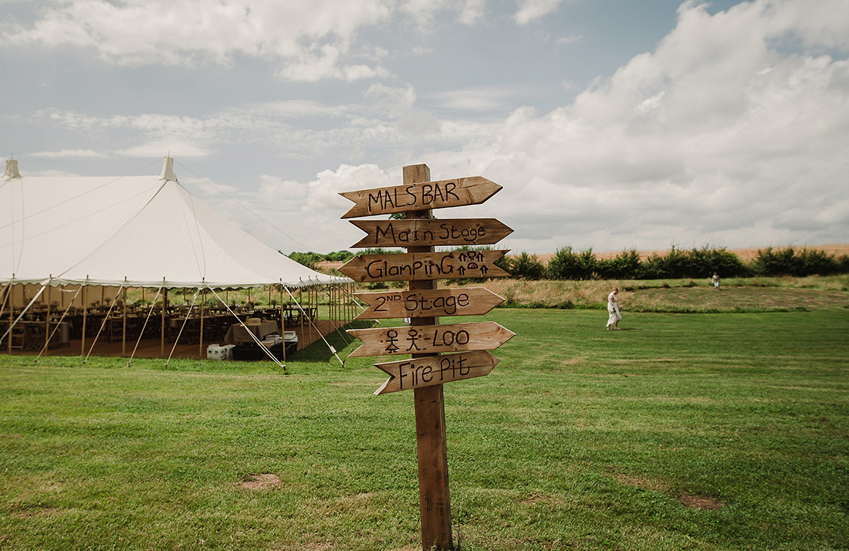 Posie wore a Delphine Manivet gown for her rustic, handmade, outdoor handfasting ceremony, captured by Amy Taylor Imaging.