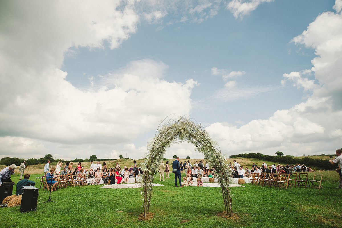 Posie wore a Delphine Manivet gown for her rustic, handmade, outdoor handfasting ceremony, captured by Amy Taylor Imaging.