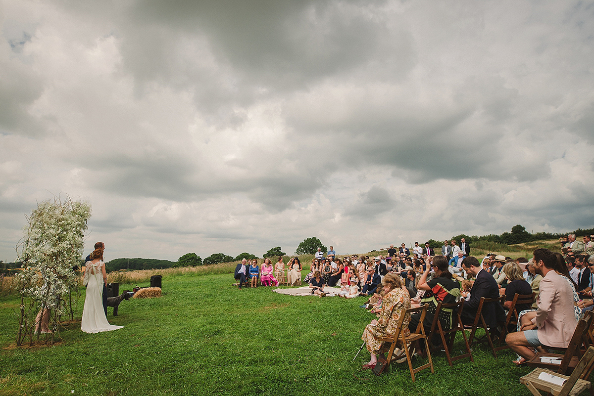 Posie wore a Delphine Manivet gown for her rustic, handmade, outdoor handfasting ceremony, captured by Amy Taylor Imaging.