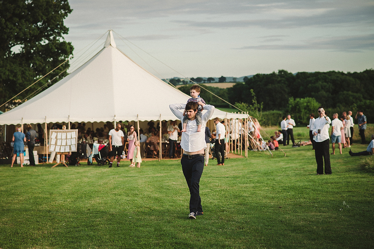 Posie wore a Delphine Manivet gown for her rustic, handmade, outdoor handfasting ceremony, captured by Amy Taylor Imaging.