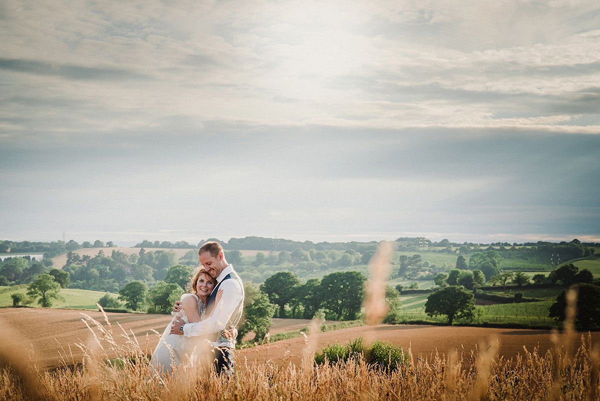 Posie wore a Delphine Manivet gown for her rustic, handmade, outdoor handfasting ceremony, captured by Amy Taylor Imaging.