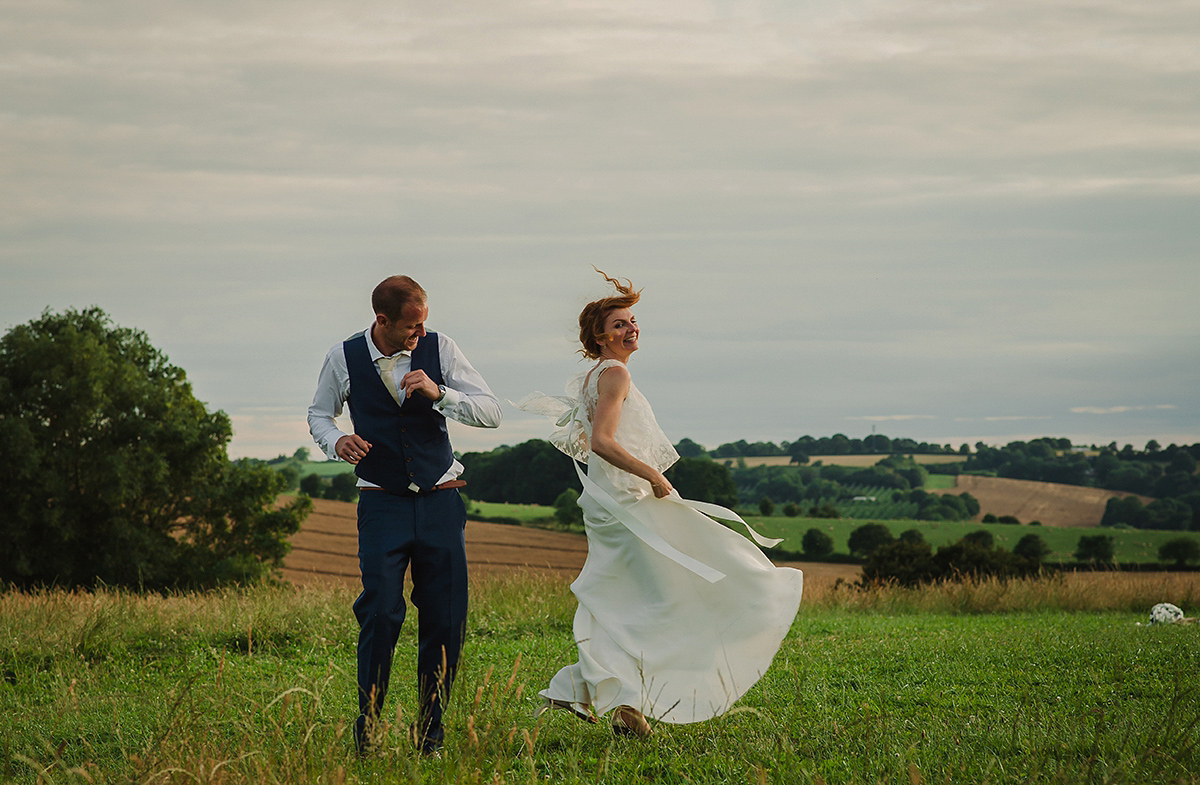 Posie wore a Delphine Manivet gown for her rustic, handmade, outdoor handfasting ceremony, captured by Amy Taylor Imaging.