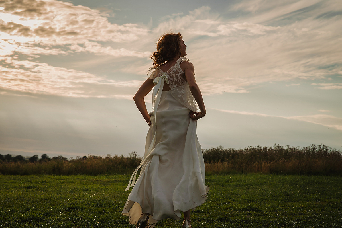 Posie wore a Delphine Manivet gown for her rustic, handmade, outdoor handfasting ceremony, captured by Amy Taylor Imaging.