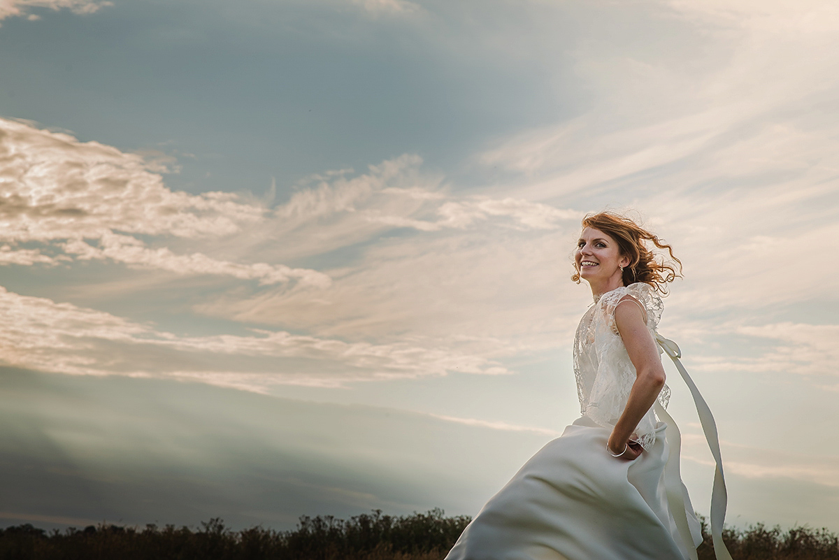 Posie wore a Delphine Manivet gown for her rustic, handmade, outdoor handfasting ceremony, captured by Amy Taylor Imaging.