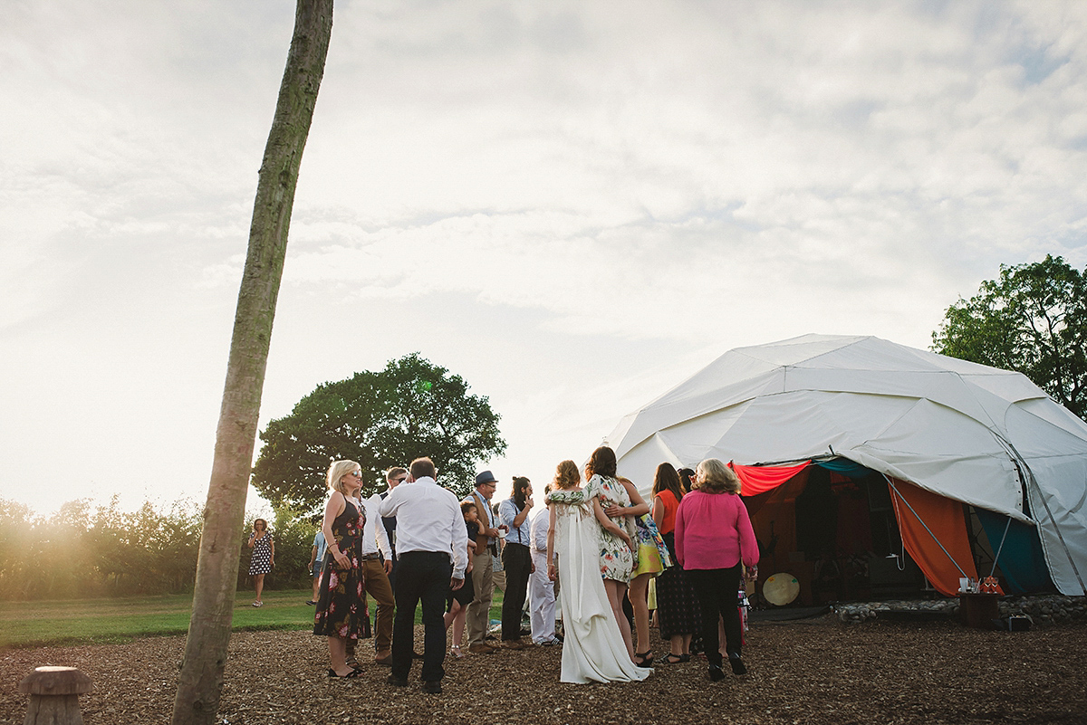 Posie wore a Delphine Manivet gown for her rustic, handmade, outdoor handfasting ceremony, captured by Amy Taylor Imaging.