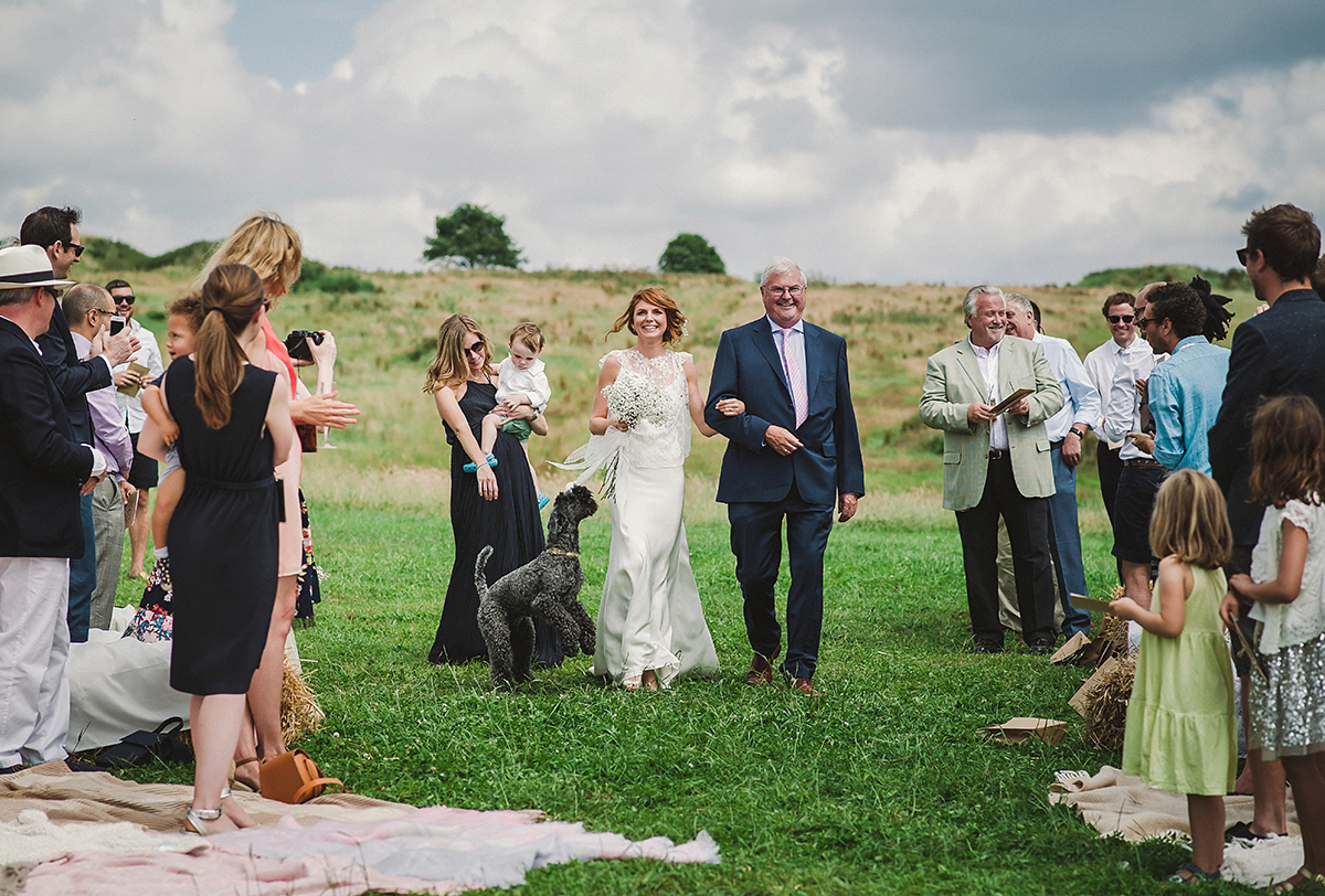 Posie wore a Delphine Manivet gown for her rustic, handmade, outdoor handfasting ceremony, captured by Amy Taylor Imaging.